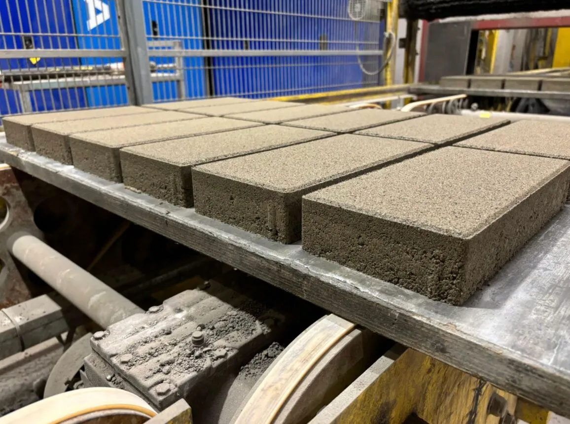 Freshly pressed concrete blocks made with captured CO₂